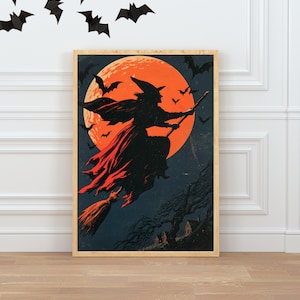 K&ouml;nnte beinhalten: Ein gerahmter, rechteckiger Wandkunstdruck mit der Silhouette einer Hexe auf einem Besenstiel vor einem gro&szlig;en, orangefarbenen Vollmond. Der dunkelblaue Nachthimmel zeigt mehrere fliegende Flederm&auml;use und die Silhouette eines Hauses.