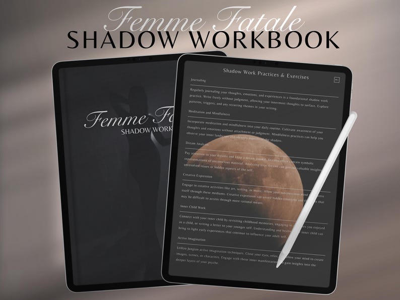 May include: Two black tablets with the text "Femme Fatale Shadow Workbook". One tablet displays a workbook page with text and a moon graphic. A white stylus rests on the screen. The workbook covers shadow work practices and exercises.