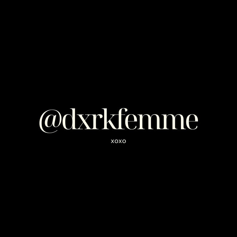 May include: A black background with the text "@dxrkfemme" in a serif font. The word "xoxo" is below the text in a smaller font. The text is cream-colored.