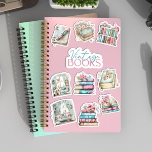 May include: A set of eight vintage book themed stickers with watercolor illustrations of books, flowers, and a cozy reading nook. The stickers are on a pink background with the text "Vintage Books".