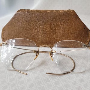 Vintage American Optical Rimless Hexagonal Bifocal Eyeglasses with old Poloroid Day Glasses Case. 1/10 12K GF. Significant chip in glass
