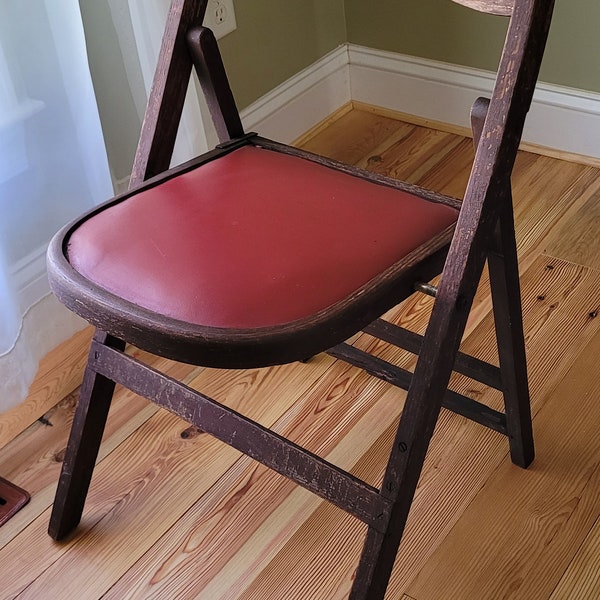 Vintage Dark Wood Folding Chair with Red/Wine Color Vinyl Seat. Still functional though back is weak, see photos! Cute Plant Stand idea?