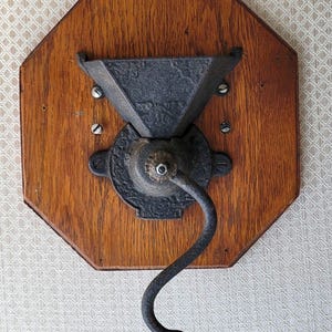 Functional Antique Wall-Mount Primitive Coffee Grinder Mill "No. 053" Cast iron on wood (Oak maybe?), 10"x 10." Perfect for use or decor!