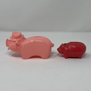 TWO Vintage Piggy Banks - Red Plastic Celluloid Piggy Coin Bank and Pink Plastic Piggy Coin bank – 1960s