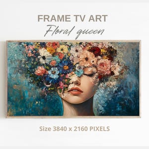 Könnte beinhalten: Gerahmter digitaler Kunstdruck mit dem Titel "Floral Queen". Das Kunstwerk zeigt das Gesicht einer Frau, das teilweise von einem lebendigen Arrangement farbenfroher Blumen verdeckt wird. Die Farbpalette umfasst Blau-, Rosa- und Gelbtöne. Das Bild trägt die Bezeichnung "Frame TV Art".