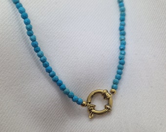 Beaded necklace with buoy clasp