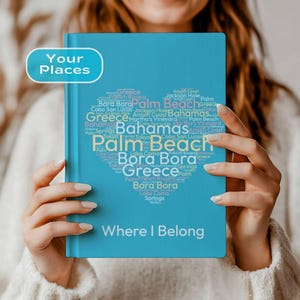 May include: A blue journal with the words "Your Places" in a white bubble. The cover features a heart-shaped design filled with travel destinations like Palm Beach and Bora Bora. The text "Where I Belong" is at the bottom.