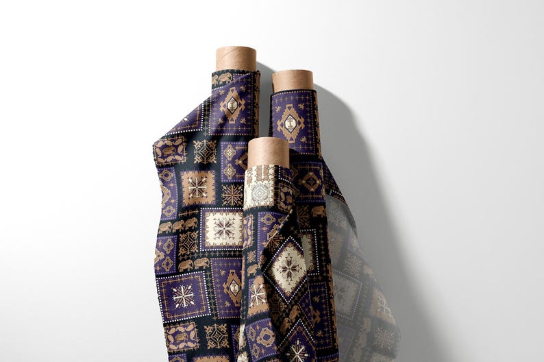 May include: Three rolls of fabric featuring a repeating pattern of geometric shapes, elephants, and floral designs in purple, black, and tan. The fabric is rolled around cardboard tubes.