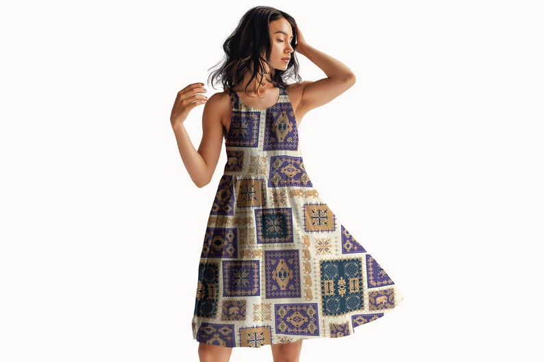 May include: A sleeveless dress with a patchwork design featuring squares in shades of purple, tan, and blue. The dress has a flared skirt and a scoop neckline. The pattern includes geometric and animal motifs.