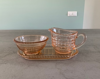 Three-piece pink pressglass creamer