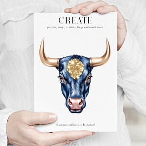 Pode incluir: Um cart&atilde;o branco segurado por uma pessoa apresenta uma ilustra&ccedil;&atilde;o detalhada da cabe&ccedil;a de um touro. O touro tem um rosto azul escuro, um nariz rosa e chifres dourados. O cart&atilde;o diz "CREATE" com texto abaixo indicando os produtos dispon&iacute;veis.