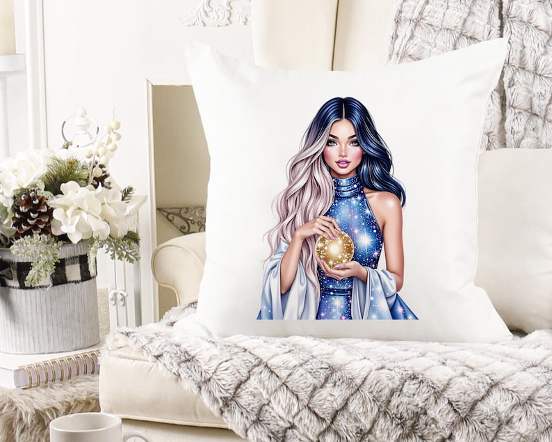 May include: White square throw pillow featuring a digital illustration of a woman with blue and silver hair, holding a golden orb. The woman is wearing a blue dress with a starry pattern. The pillow is on a white couch.