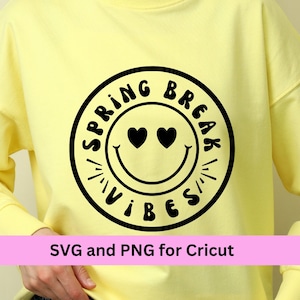 May include: Yellow sweatshirt with a black graphic of a smiley face with hearts for eyes and the text "Spring Break Vibes" in a circle.