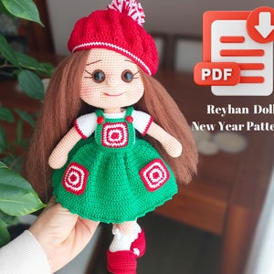 May include: Crochet doll pattern for a New Year's doll wearing a red and white hat, green dress, and red shoes. The pattern is available as a PDF download.