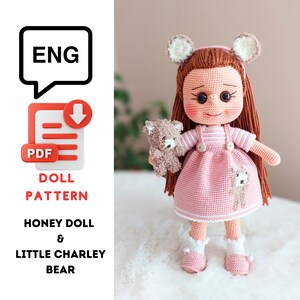 May include: Crochet pattern for a doll and a bear. The doll is wearing a pink dress and has brown hair. The bear is brown and has a white face. The pattern is available in English and is a PDF download.