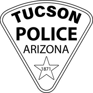 May include: Black and white badge with the text "TUCSON POLICE ARIZONA" and a five-pointed star with the number "1871" inside.