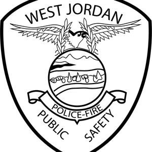 May include: Black and white illustration of a shield with the words "West Jordan Public Safety Police-Fire" inside. An eagle with outstretched wings and a globe with mountains and a river are above the text.