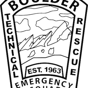May include: Black and white illustration of a badge with the text "BOULDER TECHNICAL EMERGENCY SQUAD" and "EST. 1963" with a mountain range and clouds in the center.
