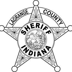 May include: Black and white illustration of a sheriff's badge with a five-pointed star. The star has the words "Lagrange County" on the outer rim and "Sheriff Indiana" in the center.