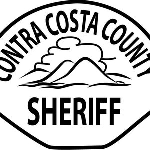 May include: Black and white badge with the text "Contra Costa County Sheriff" and a stylized image of a mountain range and a cloud.