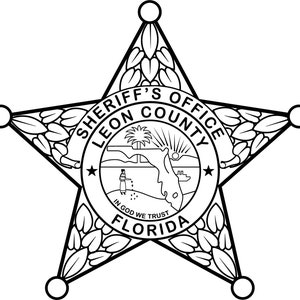 May include: Black and white illustration of a sheriff's star badge with the text "Sheriff's Office Leon County Florida" and "In God We Trust" inside a circle.