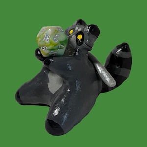 fighter raccoon dice holder