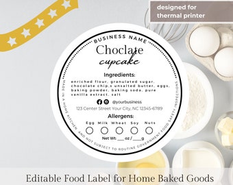 May include: A black and white circular food label for chocolate cupcakes. The label includes the business name, ingredients, allergens, and contact information. The label is designed for a thermal printer.