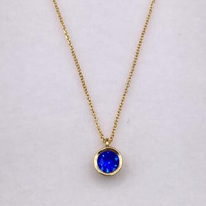 9k gold necklace with blue zircon stone