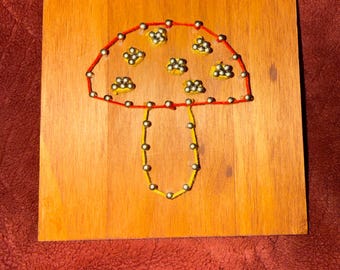 Letrero colgante de pared con forma de hongo