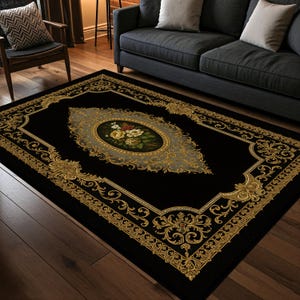May include: A rectangular black area rug with an ornate gold border and a central oval design. The oval features a floral arrangement in shades of yellow, white, and red. The rug's design is symmetrical and traditional.