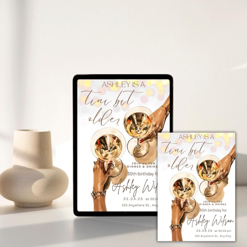 May include: A digital invitation for a 30th birthday party with a gold and white color scheme. The invitation features a graphic of two hands holding martini glasses and the text "Ashley is a tiny bit older".