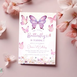 May include: A pink and purple butterfly birthday invitation with a floral design. The text reads "Our Little Butterfly is Turning 1. Join us to celebrate Olivia's 1st Birthday. Saturday, November 18th, 200 to 400 pm. 1234 Arawhere st, Any Cly, ST. Please RSVP to NameABC at 123 415 3456."