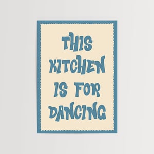 May include: A rectangular wall art print with a cream-colored background and a blue scalloped border. The text "THIS KITCHEN IS FOR DANCING" is displayed in large, blue, stylized letters, perfect for kitchen decor.