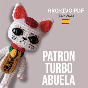 Puede incluir: Patrón de crochet para un gato blanco con manchas rojas y una campana. El patrón se llama "Patron Turbo Abuela" y está en español. La imagen incluye una bandera española.
