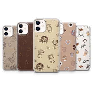 May include: Five phone cases with coffee-themed designs. The cases feature illustrations of coffee cups, beans, and coffee makers in shades of brown and beige. The cases are designed for a smartphone.