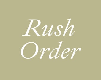 May include: The words "Rush Order" are displayed in elegant white script on a muted olive-green background. The text is centered, with the words stacked vertically, creating a simple yet impactful design.