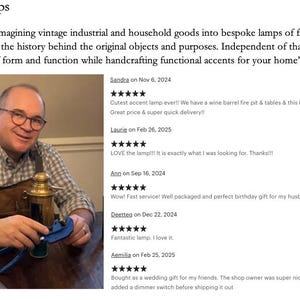 May include: A man is holding a vintage-style lamp made from a repurposed metal container. The lamp has a brass finish and a clear glass shade. The man is wearing a brown leather vest and a plaid shirt. The image includes text that reads "Rustic Craft Lamps" and includes customer reviews.