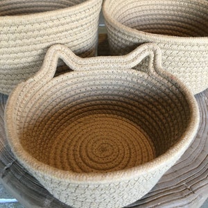 The 3 woven rope cotton baskets with cute cat ears, showing the 3 different sizes for everywhere in your home!
