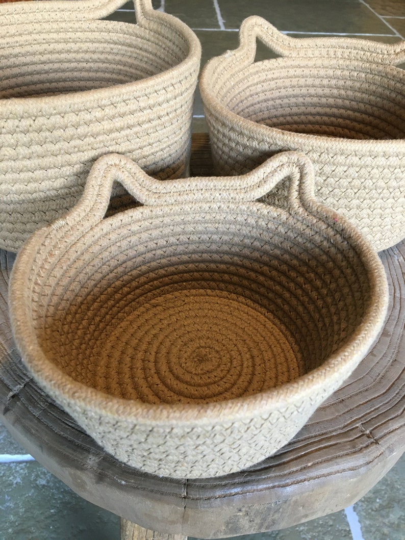 The 3 woven rope cotton baskets with cute cat ears, showing the 3 different sizes for everywhere in your home!