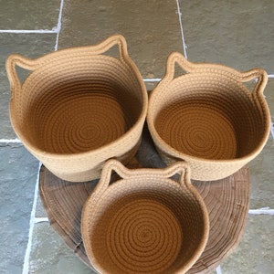 The 3 woven rope cotton baskets with cute cat ears, showing the 3 different sizes for everywhere in your home!