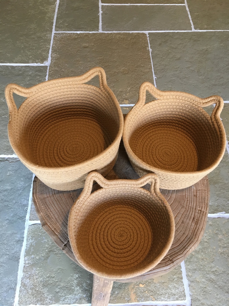 The 3 woven rope cotton baskets with cute cat ears, showing the 3 different sizes for everywhere in your home!