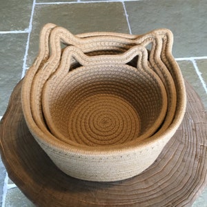 The 3 woven rope cotton baskets with stylish cat ears, showing the 3 different sizes for everywhere in your home!