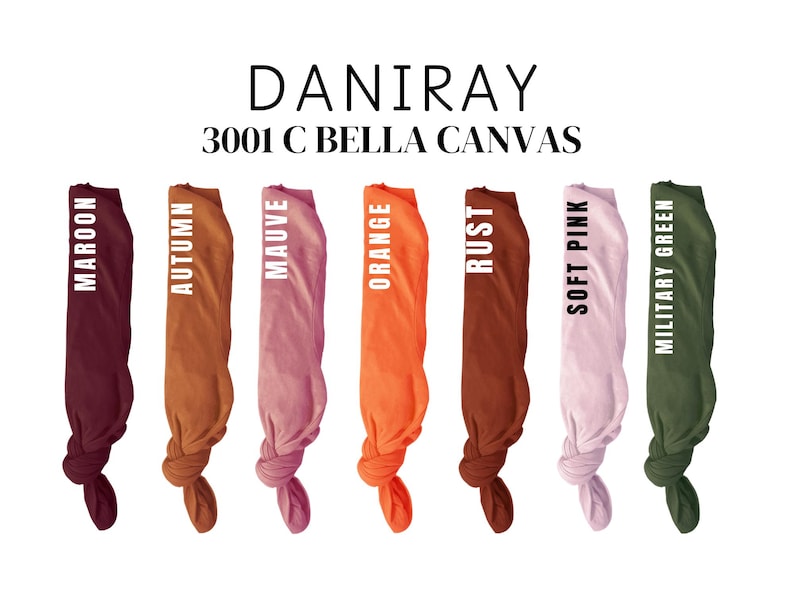 May include: Seven fabric swatches in different colors, including maroon, autumn, mauve, orange, rust, soft pink, and military green. The swatches are tied in a knot at the bottom. The text "DANIRAY 3001 C BELLA CANVAS" is displayed above the swatches.