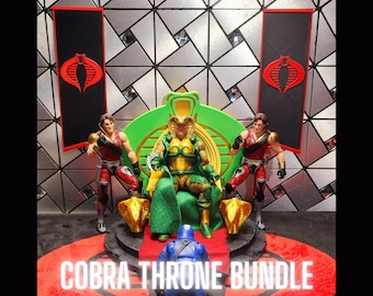 May include: A Cobra Throne Bundle featuring action figures and accessories. The central figure sits on a green and gold throne, flanked by two figures in red and gold. The scene includes banners with a red cobra logo and the text "COBRA THRONE BUNDLE".