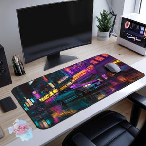 May include: A rectangular mousepad featuring a vibrant, neon-lit cityscape with a teal sports car. The design includes colorful reflections and Japanese signage. A computer mouse rests on the pad, which is labeled "Artistic Mousepads."