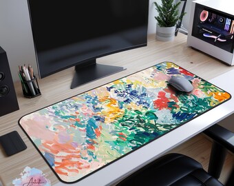Könnte beinhalten: Ein Mauspad mit einem farbenfrohen abstrakten Kunstdesign und einem schwarzen Rand. Das Mauspad zeigt eine Vielzahl von Farben, darunter Pink, Blau, Grün, Gelb und Orange. Das Design erinnert an ein Gemälde mit Pinselstrichen und Texturen.