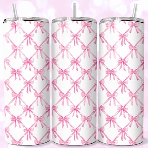 May include: Three white stainless steel tumblers with pink watercolor bow designs. The bows are arranged in a repeating pattern.