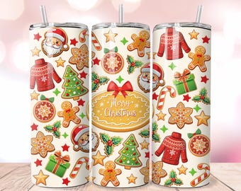 May include: Three stainless steel tumblers with a festive Christmas design. The design includes gingerbread men, Santa faces, Christmas trees, and the words "Merry Christmas". The tumblers have a cream background and are decorated with red, green, and gold accents.