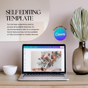 May include: A laptop displaying a floral design template, with the text "SELF EDITING TEMPLATE" at the top. A white bowl and a vase with dried foliage are on the wooden surface. The Canva logo is visible.