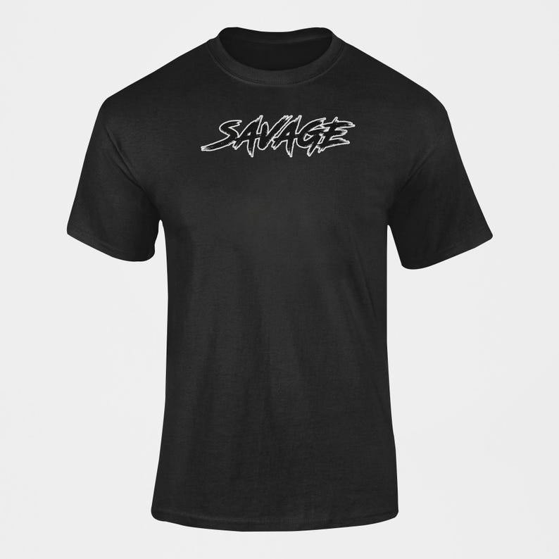 May include: A black t-shirt with the word 'SAVAGE' printed in white on the front.